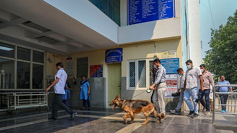 Dog squad of Delhi Police inspect the premises of Deep Chand Bandhu Hospital after four Delhi hospitals received bomb threats on email, in New Delhi, Tuesday, May 14, 2024. 