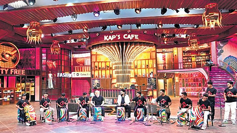 Abhijit Jejurikar (extreme left corner) with his band Dharavi Reloaded performing alongside iconic pop singer Ed Sheeran and Kapil Sharma 