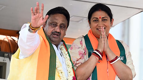 BJP leader Smriti Irani with party candidate from Chandni chowk seat Praveen Khandelwal seen during roadshow at Ashok Vihar on Thursday.