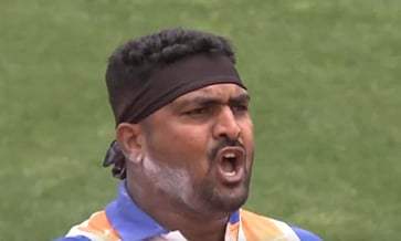 Sachin Sarjerao Khilari reacts after heaving the iron ball to a distance of 16.30 metres