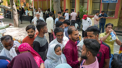 : Family members cry at a mortuary where bodies of newborns, who died in a fire at children's hospital in east Delhi's Vivek Vihar, are kept, at GTB hospital in Delhi.