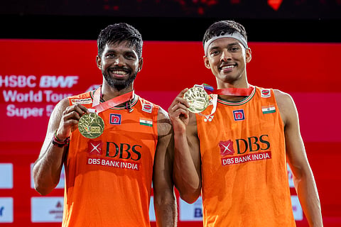 Satwiksairaj Rankireddy and Chirag Shetty pose for photographs after winning the Thailand Open Super 500 title, beating the Chinese pair of Chen Bo Yang and Liu Yi on May 19, 2024.