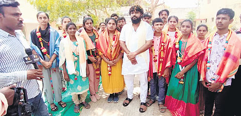 MLA Pradeep Eshwar with students who were trained under the ‘Super 60’ scheme in Bengaluru on Thursday 