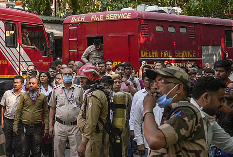 Firefighting team outside the Income Tax CR Building after a fire broke out here, in ITO area of New Delhi, Tuesday, May 14, 2024.