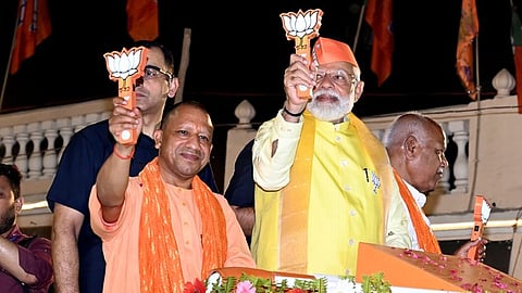 Prime Minister Narendra Modi with Uttar Pradesh Chief Minister Yogi Adityanath during a roadshow ahead of the Lok Sabha elections in Ayodhya