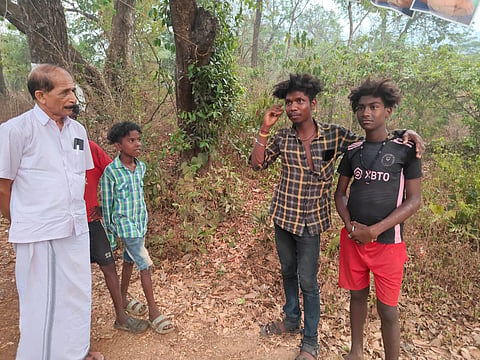 K Velayudhan, Aralam panchayat president back in 2003, who now serves as Iritty's block panchayat president seen with a few kids. 