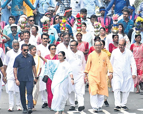 walking an extra mile: West Bengal CM Mamata Banerjee during a 12-km roadshow in South Kolkata on the last day of campaigning 