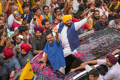 Delhi Chief Minister and AAP convenor Arvind Kejriwal with Punjab Chief Minister Bhagwant Mann during a road show for Lok Sabha elections, at Mehrauli in New Delhi, Saturday, May 11, 2024. 