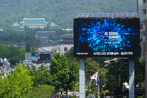 A screen shows an announcement of the AI Seoul Summit in Seoul, South Korea, Tuesday, May 21, 2024.