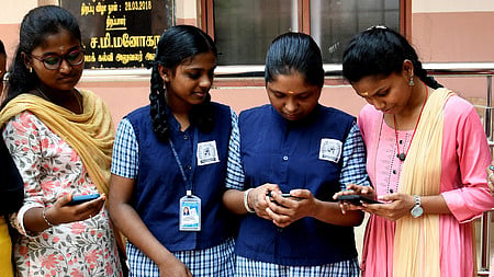 Students check their 11th standard result at Govt Girls Higher secondary school in Ashok Nagar, Chennai, May 14, 2024.