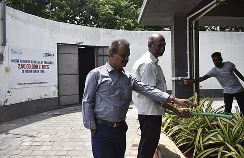 K Radhakrishnan, President, Mount Rain drops Appartment residential Association along with S Shanmuga Sundaram, Member of Mount Rain drops Appartment residential Association posing for a picture at Sewage Treatment Plant set up at a private gated community in Coimbatore on Monday. 