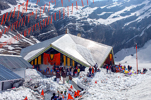 Devotees during the opening of the doors of the Gurudwara Sri Hemkunt Sahib, in Chamoli district of Uttarakhand