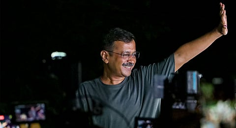 Delhi CM Arvind Kejriwal acknowledges supporters outside his residence after the Supreme Court granted him interim bail in a money laundering case, amid the ongoing LS elections, in New Delhi, Friday, May 10, 2024. 