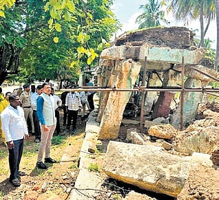 Deputy Commissioner M S Divakar inspects the damage to the monument in Hampi on Wednesday 