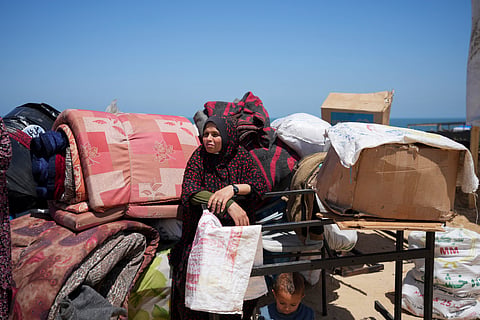 Displaced Palestinians arrive in central Gaza after fleeing from the southern Gaza city of Rafah in Deir al Balah, Gaza Strip, on Thursday, May 9, 2024.