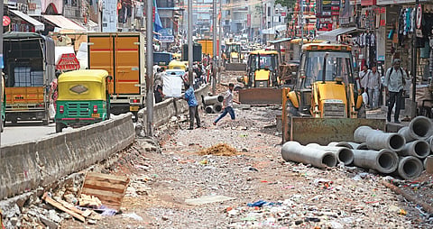 The business hub of Chickpet has now become even more chaotic with one side of the road, a major connecting link to the north and south parts of the city, closed for white-topping work 