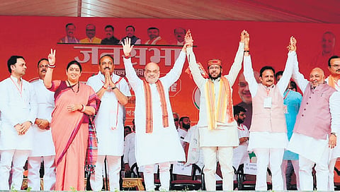 Home Minister Amit Shah with Amethi candidate Smriti Irani and other leaders at a public meeting in Rae Bareli district of Uttar Pradesh on Friday.