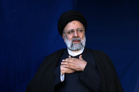 Iranian President Ebrahim Raisi places his hands on his heart as a gesture of respect to the crowd during the funeral ceremony of the victims of bomb explosion in the city of Kerman about 820 kms southwest of the capital Tehran, Iran, Jan 5, 2024.