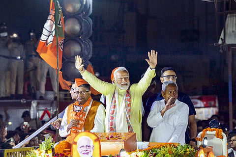Prime Minister Narendra Modi, Bihar Chief Minister Nitish Kumar and BJP candidate from Patna Sahib constituency Ravi Shankar Prasad during an election campaign roadshow for the Lok Sabha polls, in Patna, Sunday, May 12, 