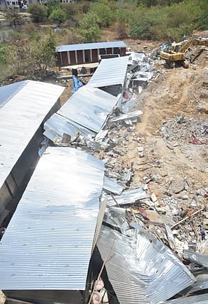 A view of the collapsed retaining wall that claimed seven lives in Bachupally on Wednesday 
