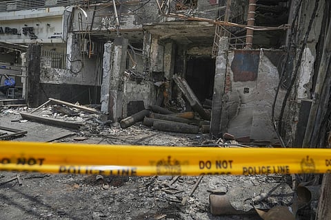 The charred building of a Baby Care Hospital after a fire broke out here on Sunday, in east Delhi, Monday, May 27, 2024.