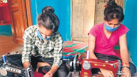 Women at the Sangini group work in the production of stitching sanitary pads in Bhind, Madhya Pradesh.
