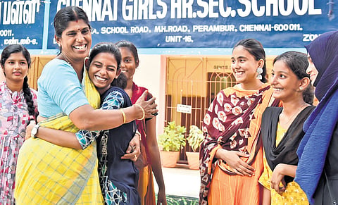 Poongothai, who scored 578 marks in class 12 exams, being congratulated by her teachers and classmates at Chennai Girls Higher Secondary School in Perambur on Monday 