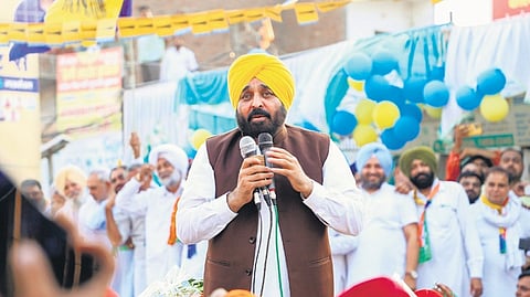 Punjab CM Bhagwant Mann during a roadshow in support of AAP candidate Sushil Gupta for Lok Sabha elections, at Pehowa in Kurukshetra district on Saturday.