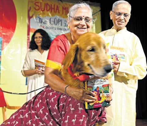 Sudha Murty with husband Narayana Murthy and her Golden Retriever Gopi at the launch event 