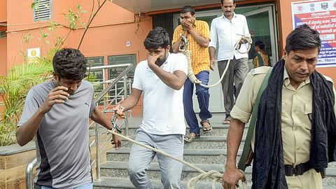 Economic Offences Unit  personnel leave with the accused arrested in connection with the alleged irregularities in NEET-UG exams 2024.