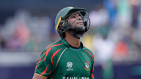 Bangladesh's Mahmudullah Riyad reacts as he walks off the field after losing his wicket during the ICC Men's T20 World Cup cricket match 