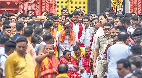CM Mohan Majhi sits on Baisi Pahacha of Puri Jagannath temple along with Dy CMs KV Singh Deo, Pravati Parida and ministers during his visit to the shrine, on Thursday 
