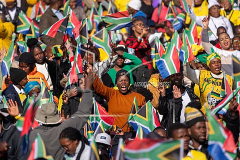 South Africans gather ahead of the inauguration of South Africa's Cyril Ramaphosa as President at the Union Buildings South Lawns in Pretoria, South Africa, on June 19, 2024.