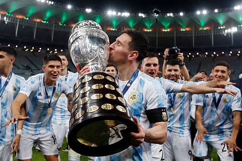 Argentina's Lionel Messi kisses the trophy after beating Brazil 1-0 in the 2021 Copa America final 