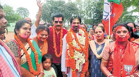 Padma Charan Haiburu of BJP celebrating his win from Karanjia Assembly constituency 