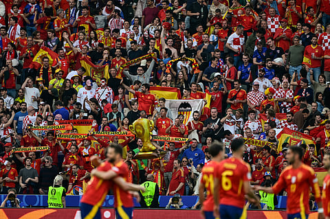 Spain supporters celebrate after the UEFA Euro 2024 Group B football match between Spain and Croatia at the Olympiastadion in Berlin on June 15, 2024.