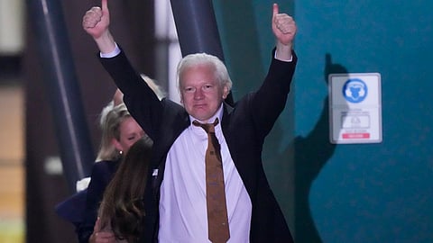 WikiLeaks founder Julian Assange gestures after landing at RAAF air base Fairbairn in Canberra, Australia, June 26 2024.