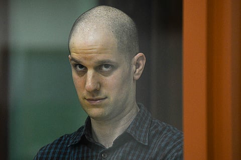 Wall Street Journal reporter Evan Gershkovich stands in a glass cage in a courtroom in Yekaterinburg, Russia, Wednesday, June 26, 2024.
