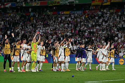 Germany's players acknowledge their supporters after winning the UEFA Euro 2024 Group A football match between Germany and Scotland on June 14, 2024.