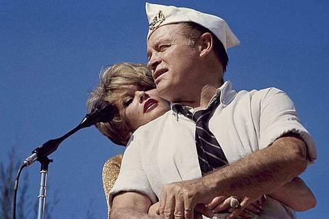Bob Hope and Janis Paige hug during the annual Christmas show in Saigon, Vietnam, Dec. 25, 1964.