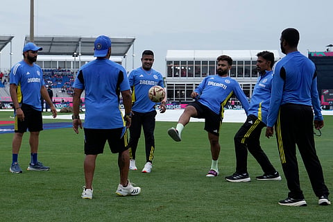 India's Rishabh Pant, third right, plays with a football with teammates and members of support staff after a wet outfield delayed the start of the T20 World Cup match against Canada (Photo | AP)