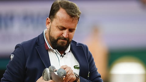 Love All! Chair umpire Damien Dumusois of France holds a pigeon that crashed onto the court during the third round match of the French Open tennis tournament between  Tomas Machac and Daniil Medvedev at the Roland Garros stadium in Paris, Saturday, June 1, 2024.