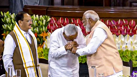 Senior BJP leader Narendra Modi and BJP national president JP Nadda with Bihar CM and JD(U) leader Nitish Kumar during the NDA parliamentary party meeting at Samvidhan Sadan. 