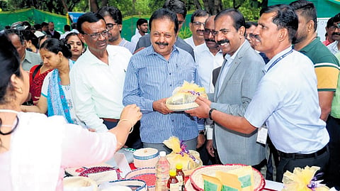 Karnataka Agriculture Minister N Chaluvarayaswamy at a stall at 
‘Product Santhe’ at GKVK Campus, in Bengaluru on Saturday   