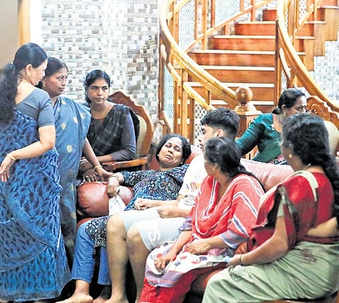 Vidhumol, wife of S Deepu, who was murdered inside his car at Kaliyikkavila, being consoled by relatives. 