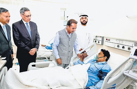 Minister of State for External Affairs Kirti Vardhan Singh meets Indians, who were injured in the fire accident, at the Jaber hospital in Kuwait on Thursday 