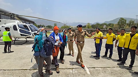 Rescued trekkers being brought to Dehradun, Wednesday, June 5, 2024. Nine trekkers who were part of a 22-member group, died after losing their way due to bad weather while on their way back from Sahastra Tal, Uttarkashi. 