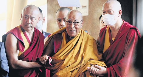 Dalai Lama arrives for a prayer at the Main Tibetan Temple in Dharamsala 