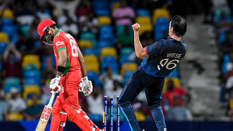 Oman's Naseem Khushi (L) is bowled by Namibia's David Wiese in the super over during the ICC men's Twenty20 World Cup 2024 group B cricket match between Namibia and Oman at Kensington Oval, in Bridgetown, Barbados on June 2, 2024.