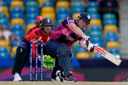 Scotland's George Munsey plays a shot from a delivery of England's Moeen Ali during an ICC Men's T20 World Cup cricket match at Kensington Oval in Barbados